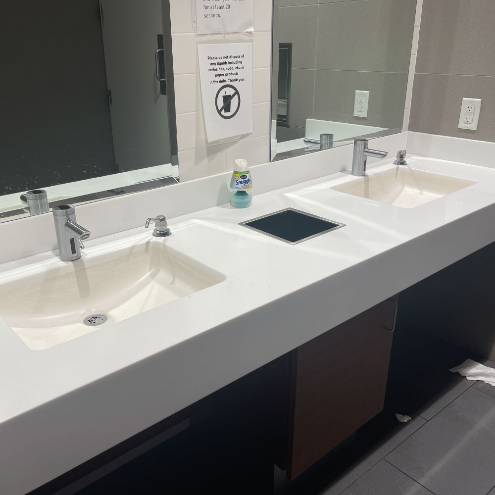 Bathroom cleaning performed in office space.