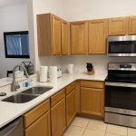 Recently completed kitchen cleaning, showcasing spotless space.