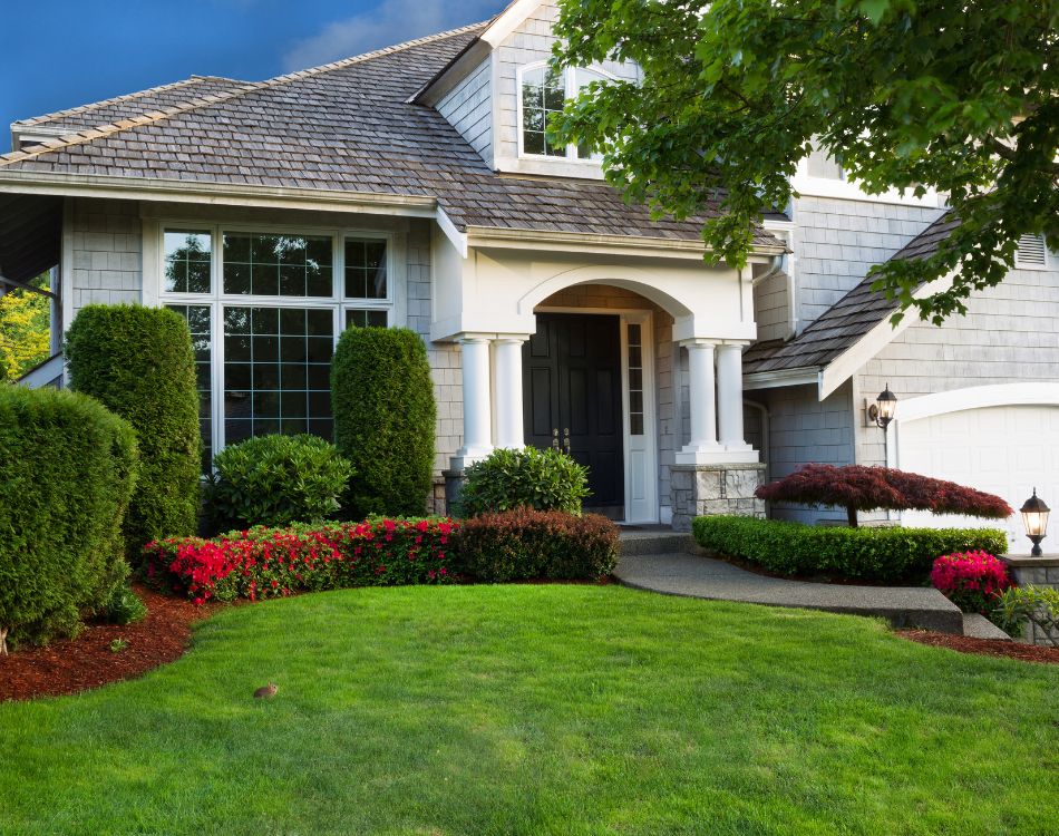 cleaned home exterior, white large house