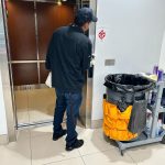 Office cleaning service, elevator being cleaned.