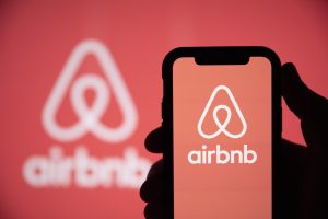 LONDON, UK May 15 2020: Airbnb home holiday rental logo on a smartphone screen